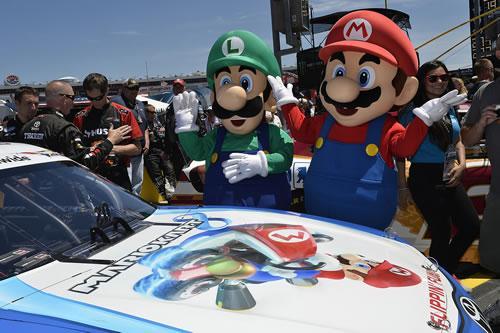 Mario and Luigi admiring the Mario Kart 8 themed NASCAR driven by Matt Kenseth