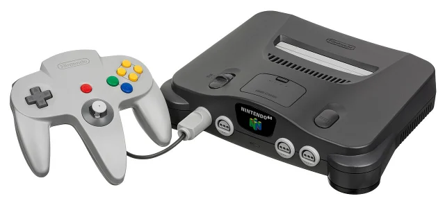 Charcoal-grey Nintendo 64 console with its grey three-pronged controller