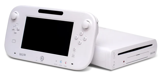 Black Wii U console standing beside the Wii U GamePad controller